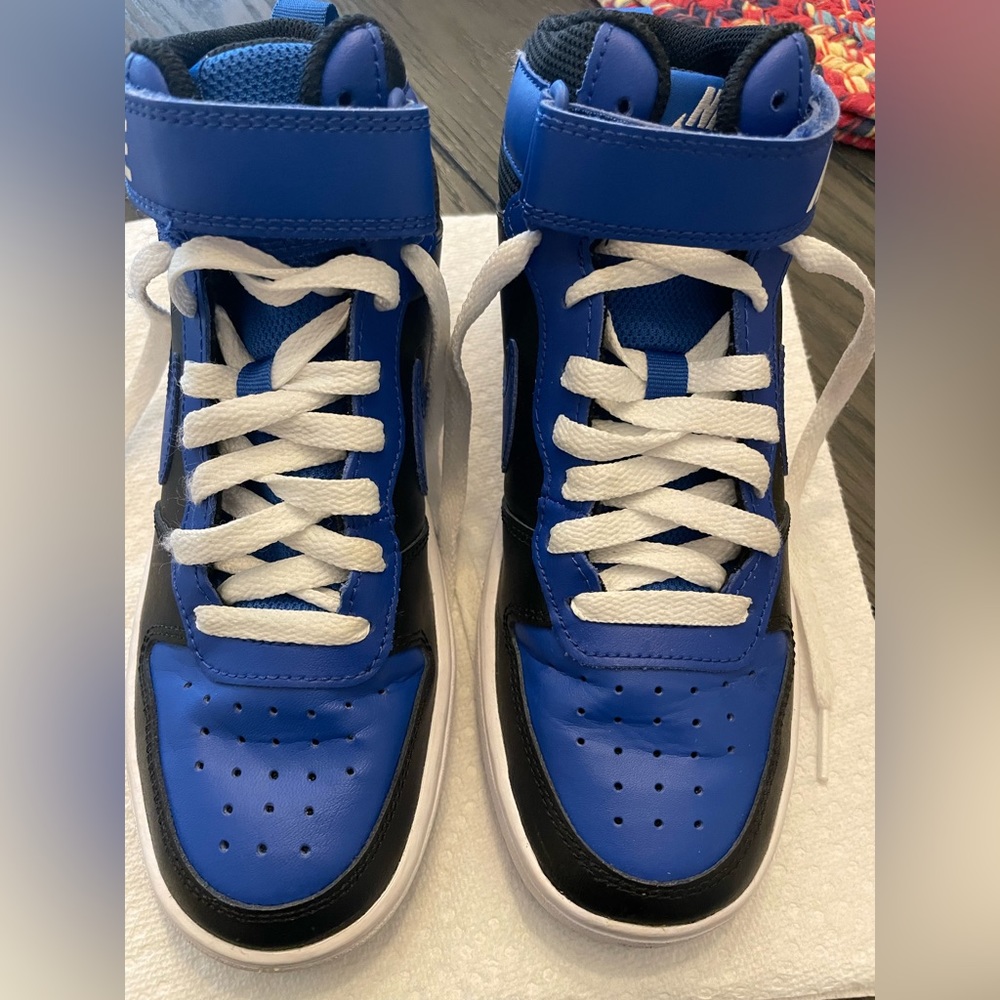 Nike Boy size 4 youth high top sneakers blue white and black like new.